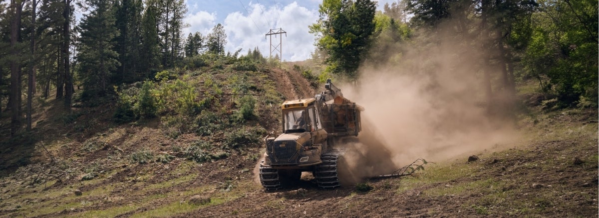 Hero Image: Tractor with dust behind