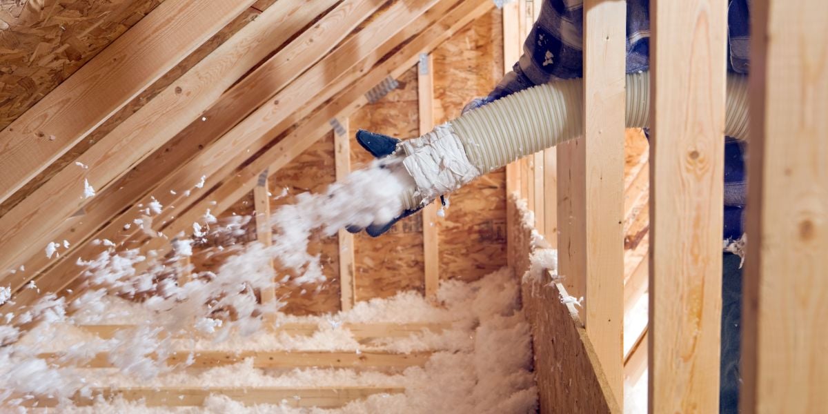 Homeowner weatherizing a door