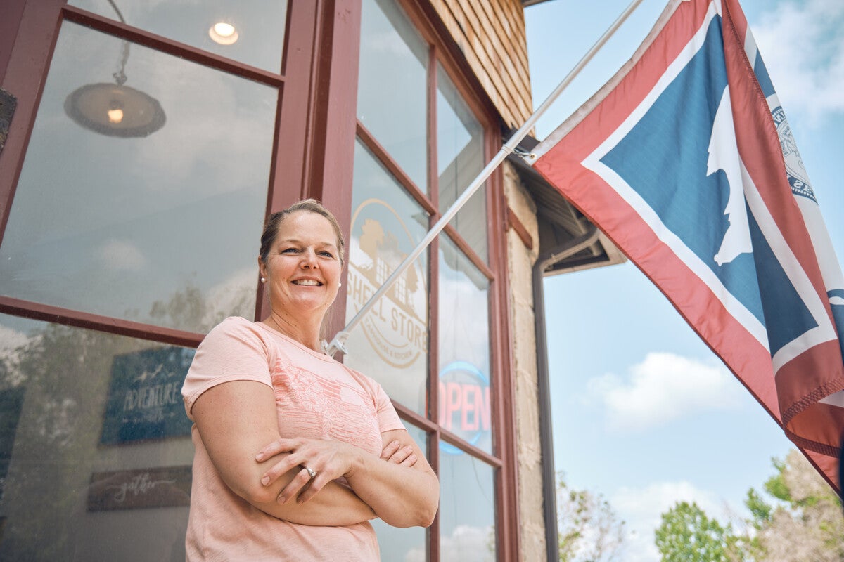 Wyoming business owner in front of store