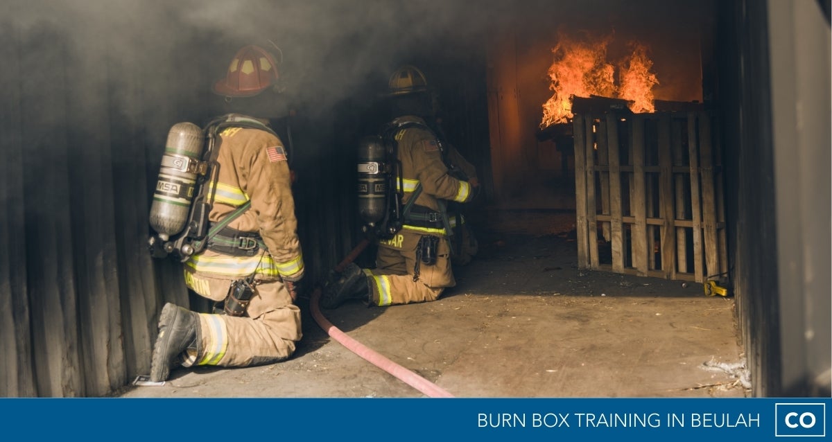 Image of firefighter with burn box in Beulah, CO