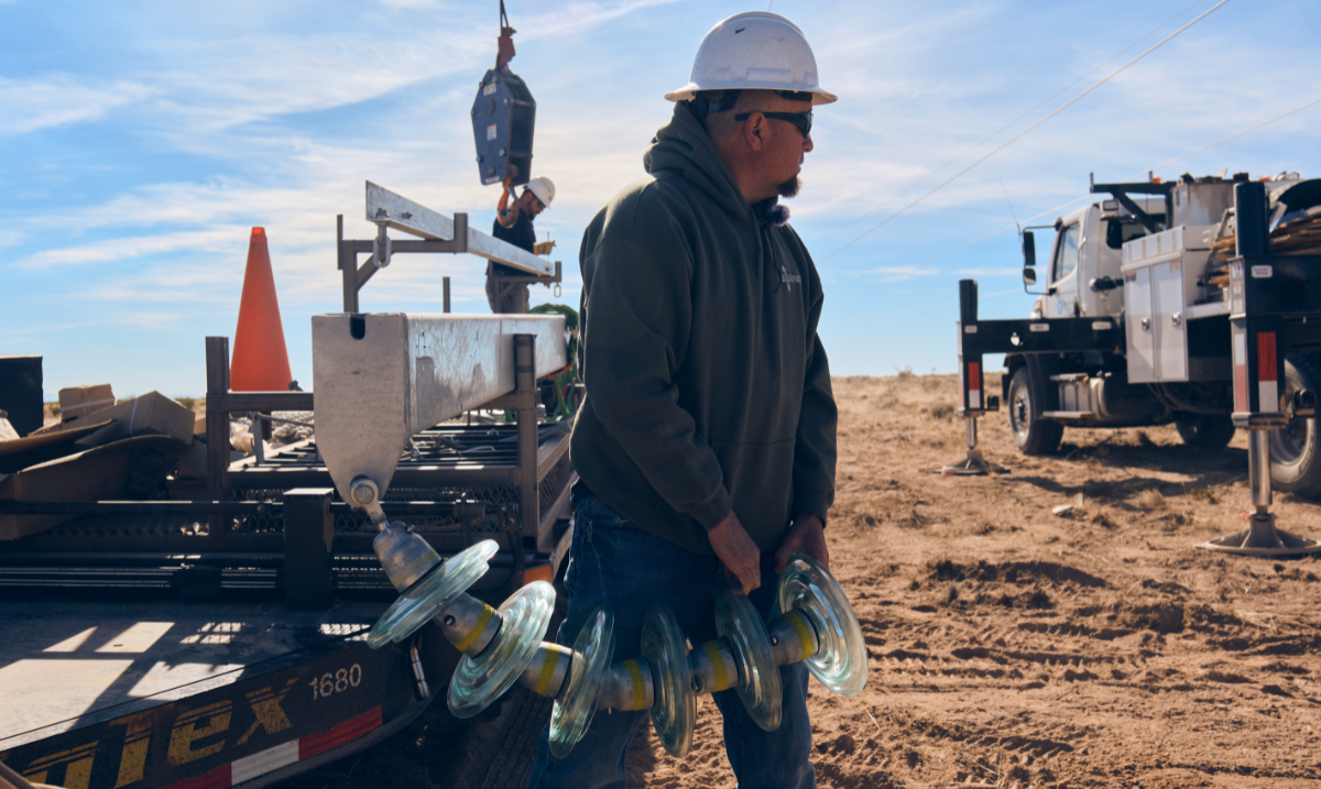 Adrian Garcia carrying insulator