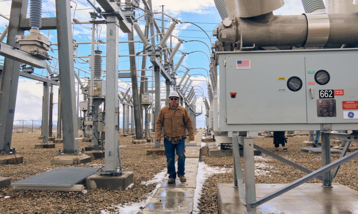 John Swanson walking through substation
