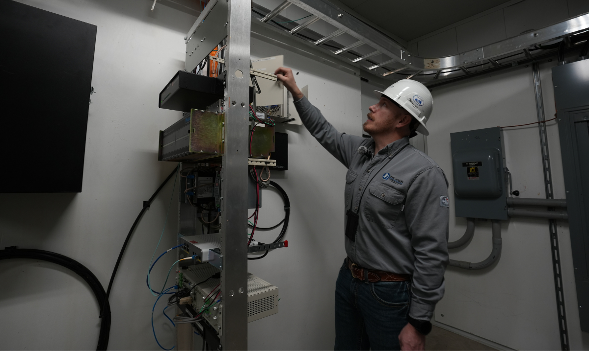 Nick Franklin reaching for cords in station