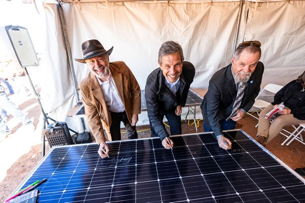 L to R: Duane Highley, CEO Tri-State, Guy Vanderhaegen, CEO & President Origis Energy, and Tim Rabon, Board Chairman Tri-State, sign a solar panel to commemorate the halfway point in construction of Escalante Solar