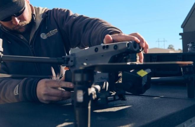Man working with drone pre-flight