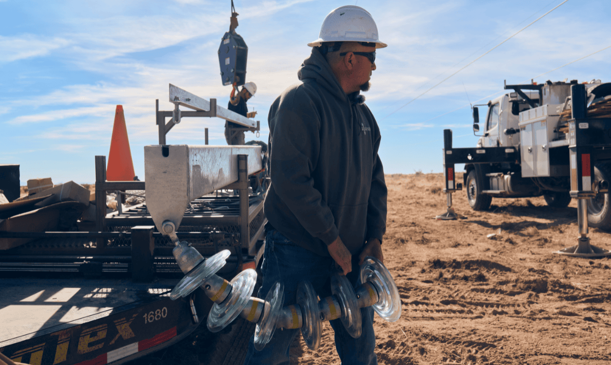 Adrian Garcia carrying insulator