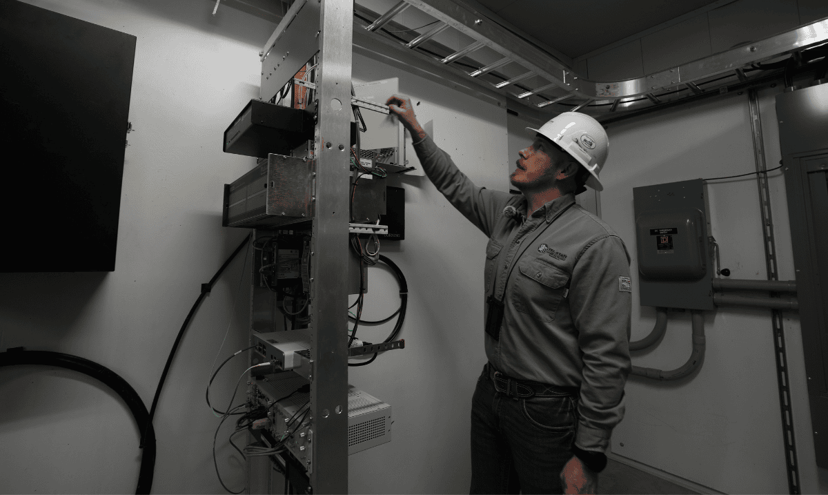 Nick Franklin reaching for cords in station