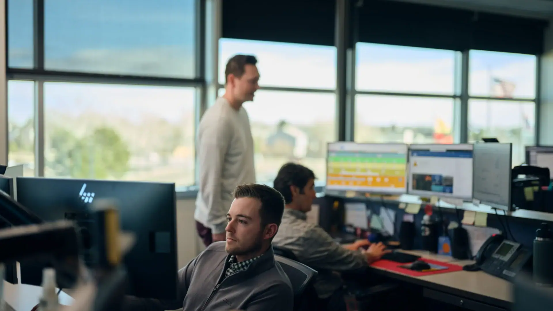 three employees working in energy markets